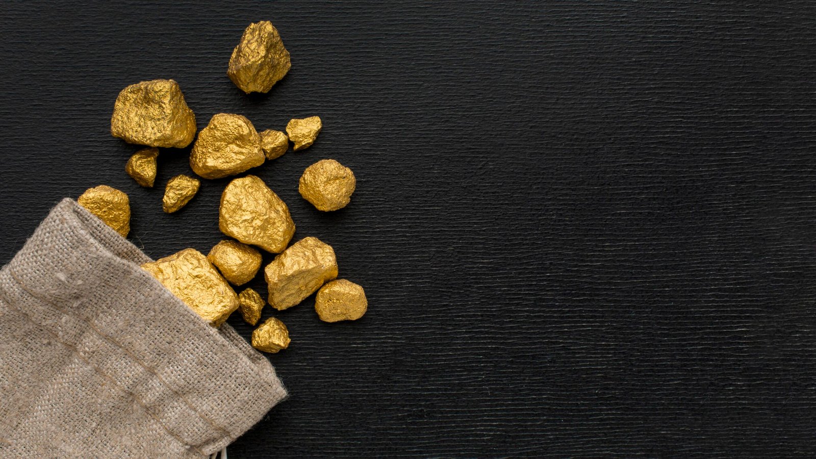 https://www.golddirect4u.com/wp-content/uploads/2022/06/top-view-gunny-sack-with-gold-ore-scaled.jpg